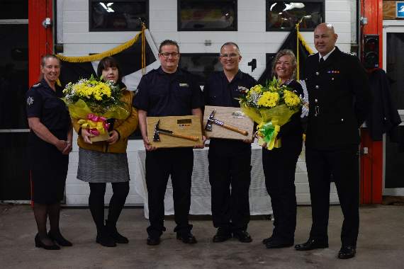 Long serving firefighters Richard Bailey and Danny Smith, pictured with their partners Kim and Nikki, received ceremonial fire axes with their start date, BA tallies, medals and ribbons. Making the presentations were Cornwall's Chief Fire Officer Kathryn Billing and Response Station Manager for East Command Mark Goldsmith. Photo: Scarlett Hills-Brooks