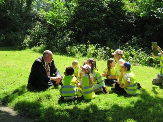 Liskeard mayor Simon Cassidy talks to children from St Martin's School during an event at Castle Park