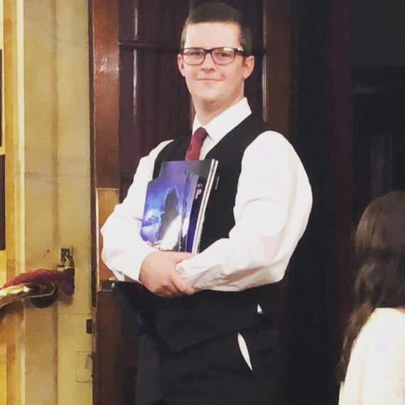Elliot in his early days working front of house at St Martin's Theatre.