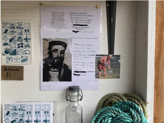 The display on the wall of a beachside cafe at Portmellon