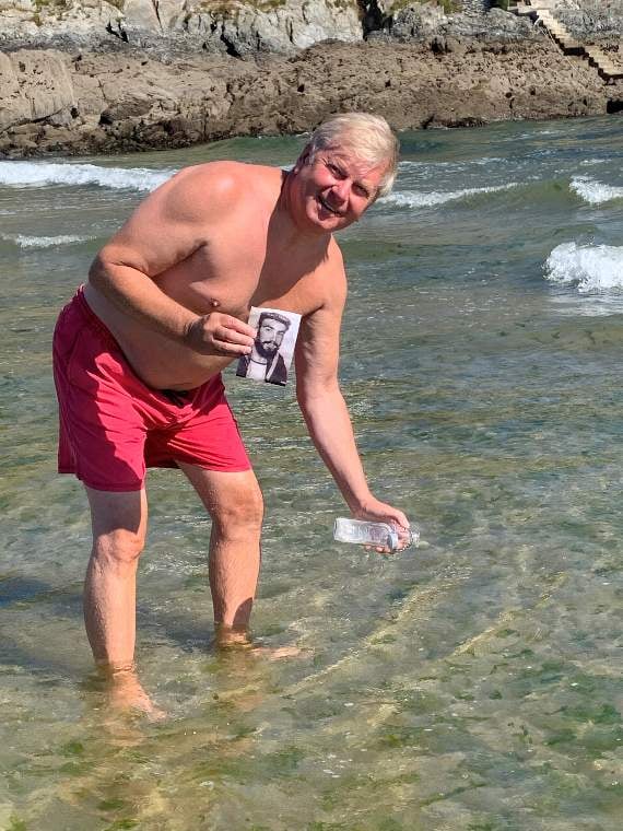 Tim Noon sprinkles Frank's ashes in the sea