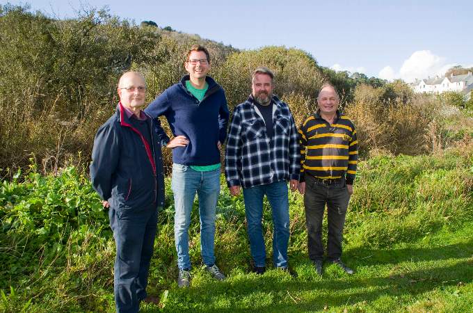 Seen from left next to the land they hope to protect are parish councillors John Croft, Martin Wiseman, parish council chair Mark Gibbons and Jim Candy. Picture: Chris Bowden