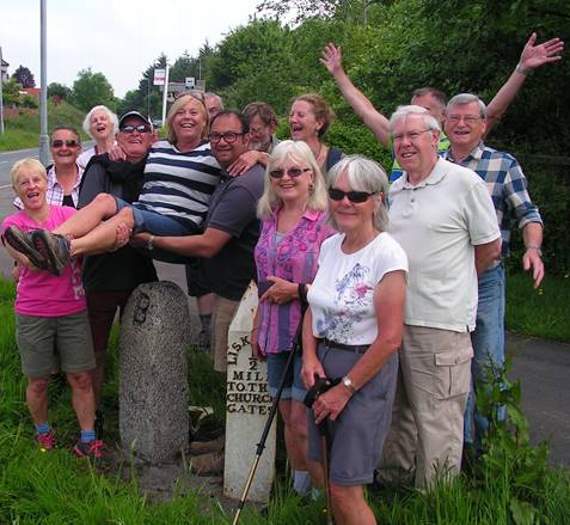 A previous Beating the Bounds walk where then mayor Jane Pascoe is 'bumped' on the boundary stone!