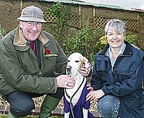 Maddy the English Pointer, owned by Penny Doe, right, of Down St Mary, was judged the “Dog Most Like the Bishop” in the fun dog show and the prize was presented by the Bishop of Exeter, the Rt Rev Michael Langrish. AQ 5976