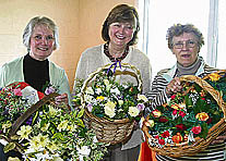 Selling beautiful buttonholes in aid of Colebrooke Parish Church were, from left, Val Pennington, Liz Smith and Margaret Widger. AQ 5979