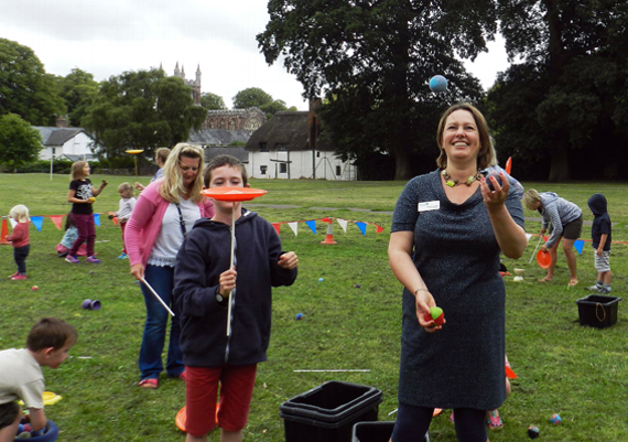 Crediton Library Supervisor: Béatrice Coveney joined in the fun when she successfully “had a go” at juggling during the Circus Skill Workshop by Dan The Hat.