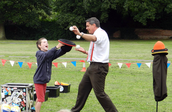 Joe Hilton helped Dan The Hat during a Circus Skills Workshop organised by Crediton Library as part of the Record Breakers Summer Reading Challenge.