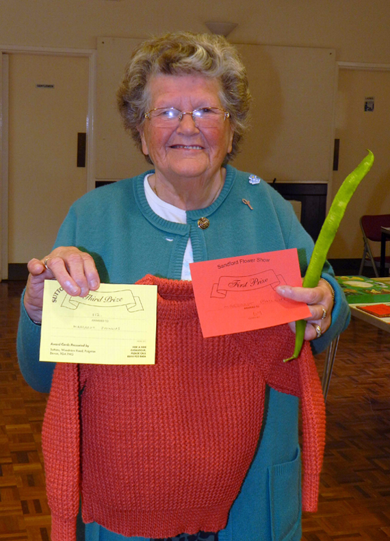 Margaret Phillips won a third for her knitted children’s jumper as well as a first for the longest runner bean.