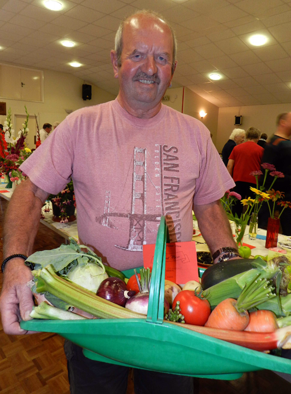 Dave Friendship won first prize at Sandford Flower Show for his selection of vegetables displayed in a trug.