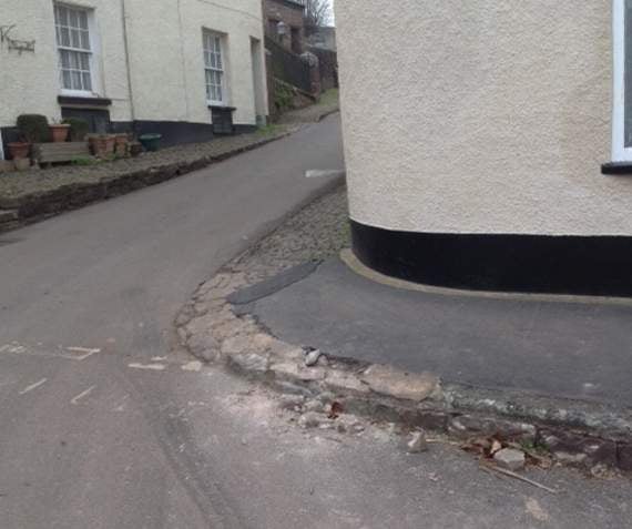 The crumbling footpath near Homeside, Sandford, which Sandford Parish Council is asking is repaired.