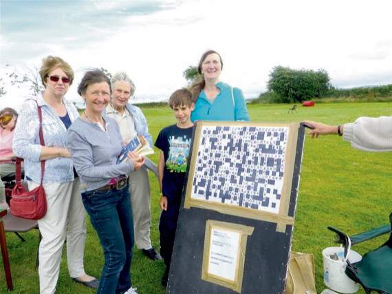 Pondering whether to go for an across or a down clue at the giant crossword. SR 1279