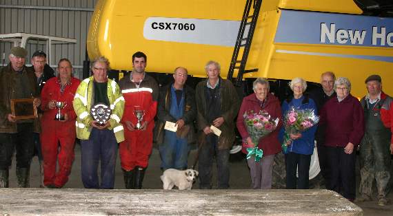 Some of the prizewinning ploughmen at the Mid Devon Ploughing Association match at Wembworthy with Mrs Sheila Kerslake, fifth right, Mrs Audrey Sanders, fourth right and Ron "Bonzo" Moyse, third right.  AQ 8280