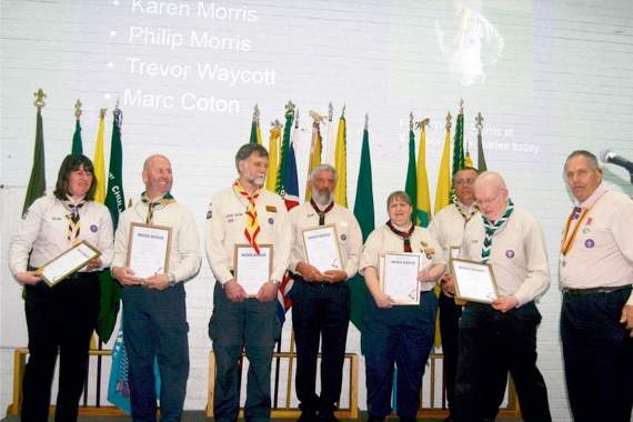 Leaders who received their Wood Badge certificates and their Wood Beads with George Davey, ADC Scouts. SR 5748
