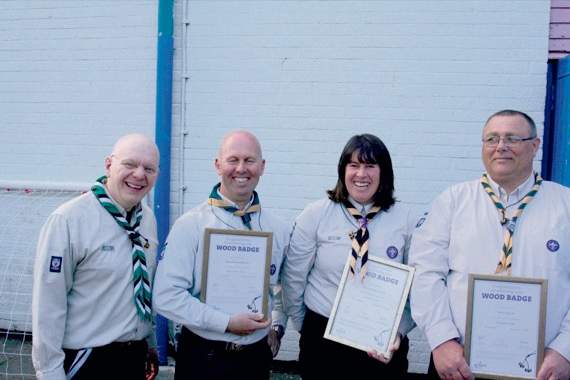 With their Wood Badge certificates and wearing their Wood Beads are Shaun Metcalf whose Scouting began in West Sussex, then a while in Crediton before joining Bow, Debbie Richards who is Group Scout Leader, Crediton who has been in Scouting for 15 years, and Trevor Waycott  of Bow, now District Scout Leader whose Scouting began with the formation of Bow in January 2015. Left is Marc Coton. So the new County Commissioner  wearing his green, black and white County scarf and the new Mid Devon District Commissioner in his District scarf are either end. SR 5765
