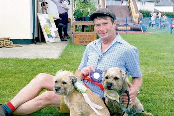 Mark Crosfield who moved into Spreyton a fortnight ago from Surrey with his wife, Lorraine, a retired maths teacher. Mark, a gardener, is with their two Border Terriers, Toby and his mum, Tilly. Toby won the class for any cross breed, reserve for best in show, runner-up for the handsomest male and other first prize places. SR 6268
