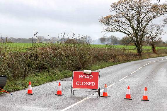 Smoke rising in the distance above a road closure sign on the A3072 between Copplestone and Bow. AQ 5406
