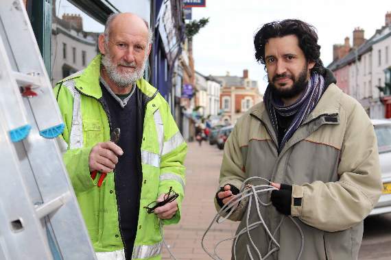 Jo Ward, electrician, of Crediton, left and his son, Philip, have completed the electrical work on the 100 trees placed on the front of buildings in Crediton by Crediton Chamber of Commerce and other volunteers, as well as other lighting for trees in the Town Square and at St Lawrence Green. AQ 5515