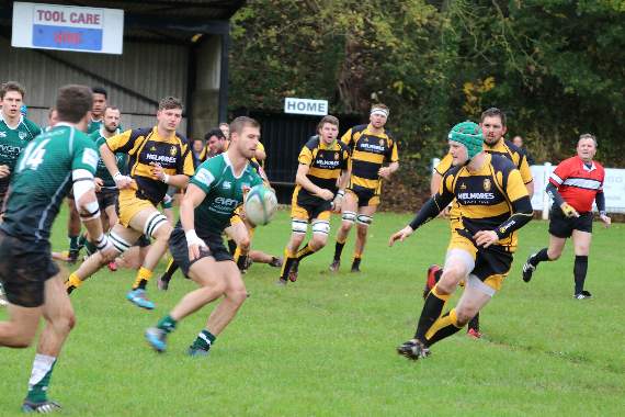 Sidmouth and Crediton look to get the ball as it is passed to a player. AQ 5434