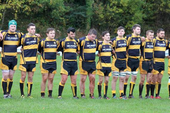 Some of the Crediton players during the two minutes’ silence to mark Remembrance before the game. AQ 5424