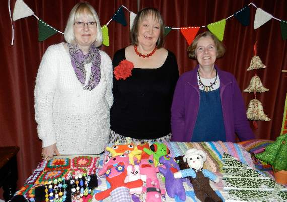 Some of the organisers of the craft group at Shobrooke Village Hall with hand-crafted items made by the group, from left, Carole Wilson, Carri Harrison and Linda Turner.