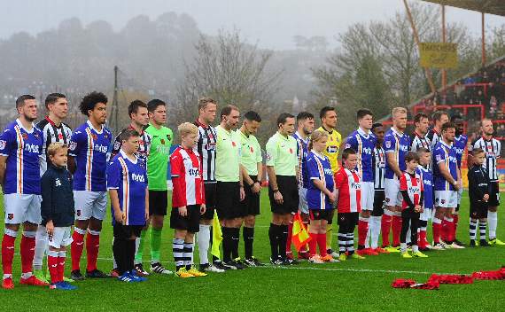Josh and Frankie line up with the Exeter City team and other mascots before the match against Grimsby Town.
