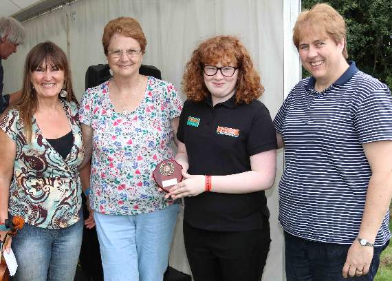 Christabel White, third left, receives the shield for the best Step Dancing at Chagford Show from the judges Shirley Bazeley, second left, and Jane White, right, with competition organiser, Lisa Sture, left, of the Dartmoor Stepdance Project. AQ 3554