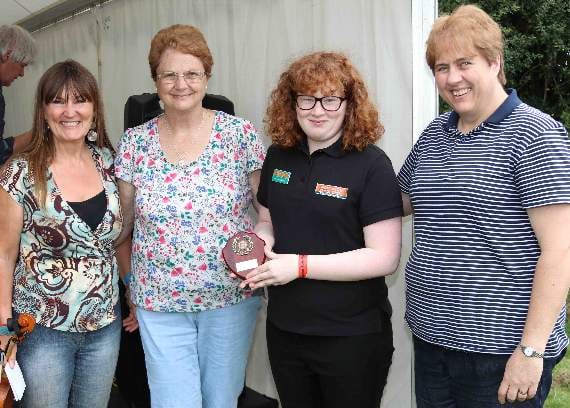 Christabel White, third left, receives the shield for the best Step Dancing at Chagford Show from the judges Shirley Bazeley, second left, and Jane White, right, with competition organiser, Lisa Sture, left, of the Dartmoor Stepdance Project. AQ 3554