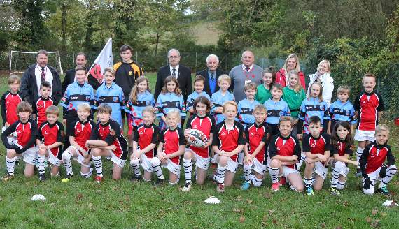 Before the Remembrance tag rugby match between teams from Hayward’s Primary School in Crediton, pictured front, with the Ide Primary School team and representatives from Ide Barbarians RFC, the Royal British Legion and Ide Primary School, with organiser, Scott Baker, back second left. AQ 5299