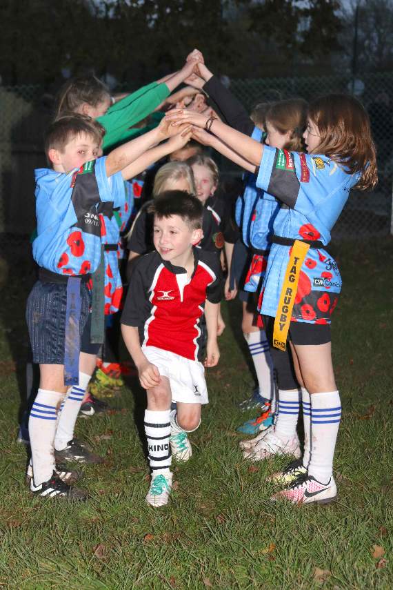 Hayward’s Primary School players walking through the arch made by Ide Primary School players following the match. AQ 5358