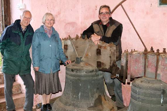 Colebrooke Church Bells Restoration Project committee members present at the open day with two of the bells, from left, Fred Oliver, Valerie Pennington and John Enderson. AQ 5665