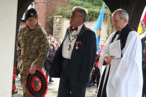 Crediton’s Mayor, Cllr Frank Letch, with the Mayor’s Cadet Cpl Lewis Cook of Crediton Detachment ACF about to lay Crediton Town Council wreath. SR 8531