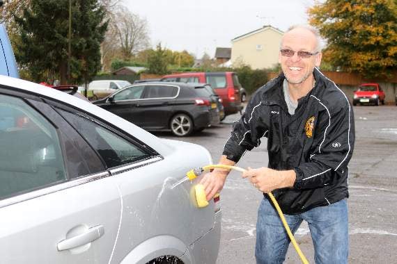 Lending a hand during the car wash in aid of Crediton RFC Under 16’s before a recent match. AQ 5372