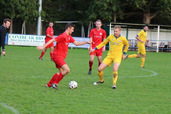 A tussle between Budleigh, left and Crediton right, during the game which ended one all. AQ 5636