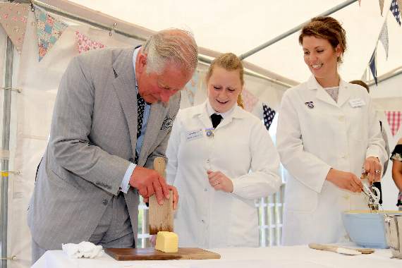 HRH The Prince of Wales tried his hand at decorating hand-made butter during his visit to Devon YFC’s new offices at Cheriton Bishop. AQ 1231