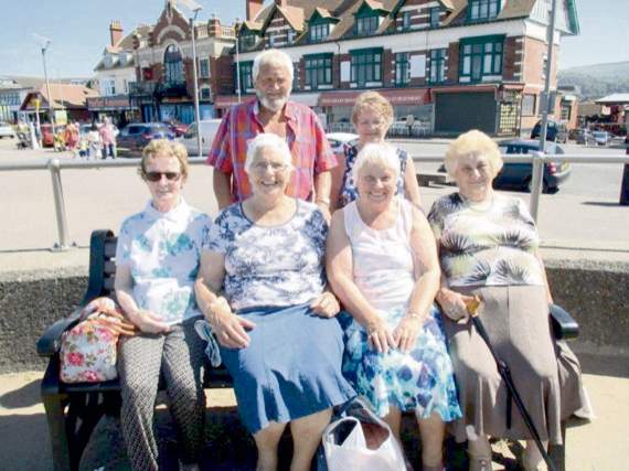 Enjoying the sunshine on Minehead sea front is Joyce Pike (second left, seated) with friends. Photos: Margaret Tucker