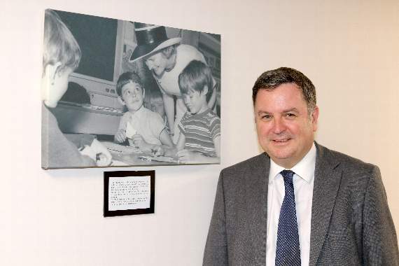 Central Devon MP Mel Stride beside an old photograph of Margaret Thatcher MP, then Secretary of State for Education and Science, when she visited the old Newton St Cyres Primary School on July 16, 1971. AQ 3417