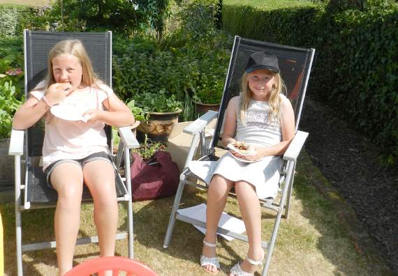 Emila (11) and Ann (10) enjoyed eating burgers in the sunshine at Yeoland. House. NP 070718 07