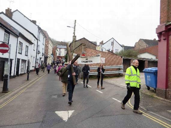 The cross is carried down North Street towards the town square. SR 1931