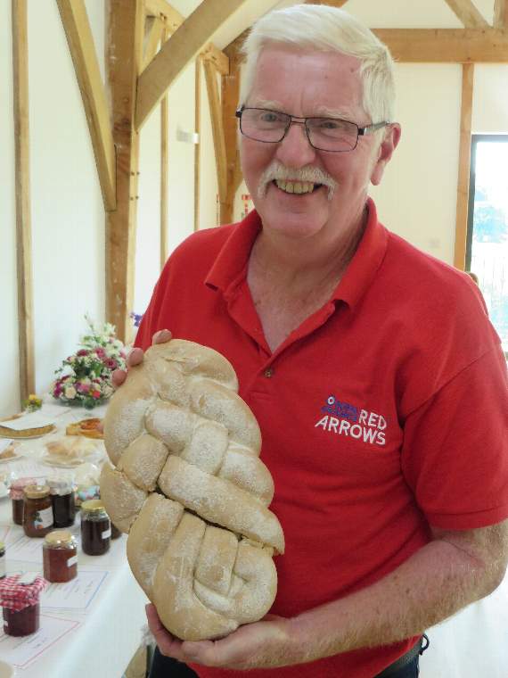 James Huntly shows his prize harvest loaf at Stockleigh Pomeroy. James usually bakes the bread at home. He also won prizes with eggs, wine and vegetables. SR 2373