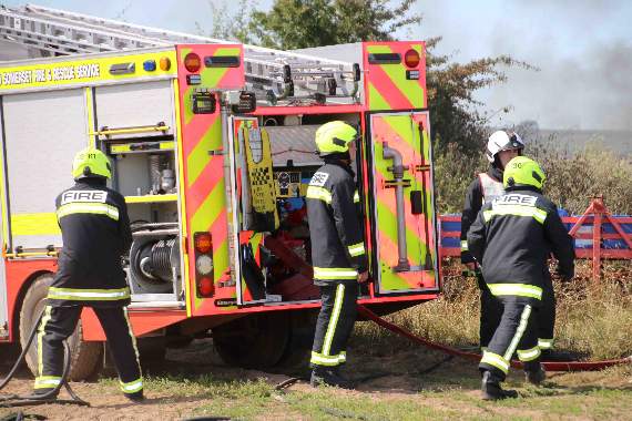 Firefighters in action at the scene at Sandford Ash, New Buildings, near Crediton. AQ 2519