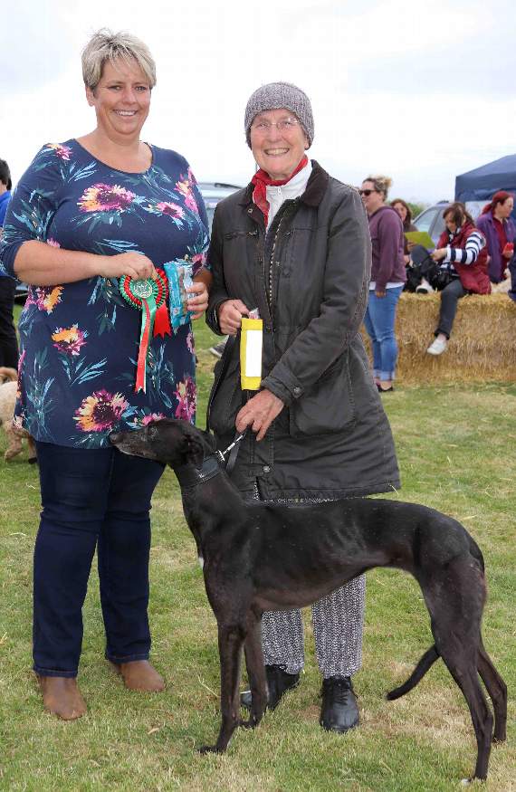 Dog show judge Emma Pullen, left and Best Rescue Dog, a seven-year-old greyhound owned by Anne Beer. AQ 2268
