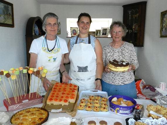Pictured with a delicious selection of cakes, from the left, Camilla Williamson, Justyna Zemczak and Marian Codner. NP 070718 05