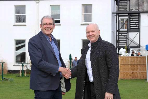 Amber CEO Paul Rosam, left, thanks Screwfix CEO Graham Bell, for the works completed at Ashley Court at Chawleigh. AQ 0173