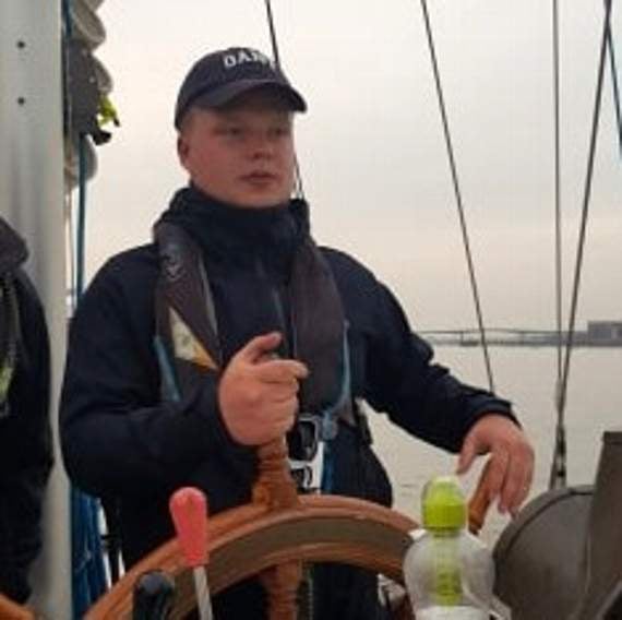 Jack steering the boat.