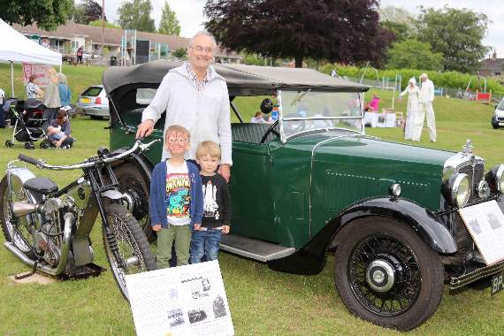 David Nation with his grandchildren Hugo and Dougie Logan, pictured with David’s 1948 speedway motorbike and his 1934 Morris Tourer car. AQ 1646