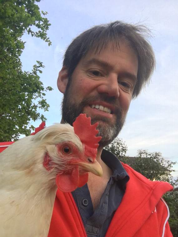 Tim Mirfin with one of his chickens.