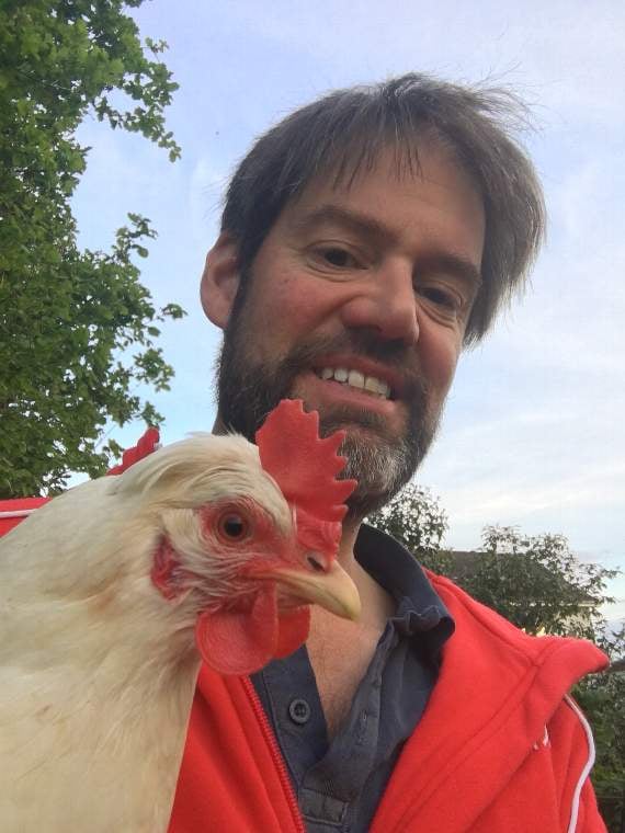 Tim Mirfin with one of his chickens.
