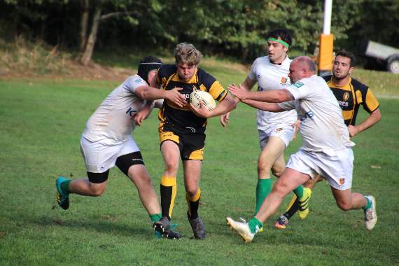 A Crediton ‘Quins player races to touch down despite three Newton Abbot player’s attempts to stop hit getting through. AQ 6071