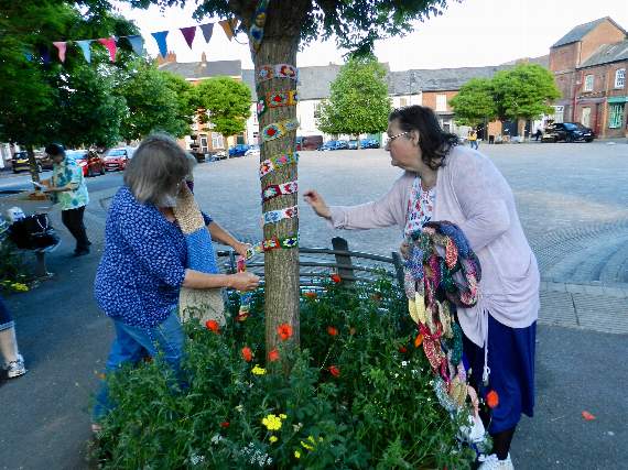 Eileen and Tracey decorated a tree on the town square with a colourful hand-knitted decoration. NP 310519 06