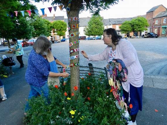 Eileen and Tracey decorated a tree on the town square with a colourful hand-knitted decoration. NP 310519 06